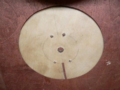 Cut a slot in the front 4 diameter disk as shown. It should be about 1/8 wide and should come right to the center, and stop between the two pins that are nearest each other.