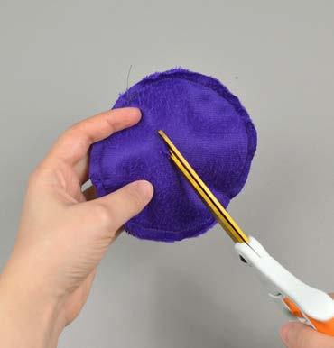 Align it over top the hat you have so far with right sides together. Push down the hat top so it's flattened.