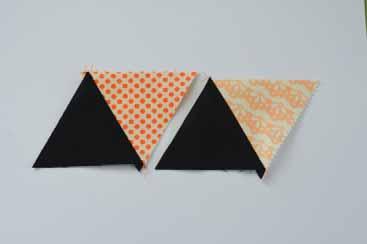 Pin the triangle strip to the top rectangle of background fabric (8½" x 21") so that the triangle points