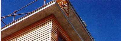 less liable to damage than an extended tongue. An additional advantage is that the bottom edge of abutting boards fixed to the vertical batten can be held and aligned with a single wide clip.