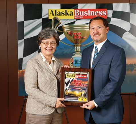 Calista Corporation Vice President of the Land and Natural Resource Department, June McAtee with Alaska Business Monthly Vice President of Sales, Charles Bell.