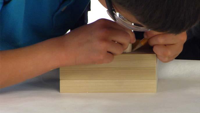 17. Trace Place a dowel on top of the stacked wood pieces and trace it so you'll