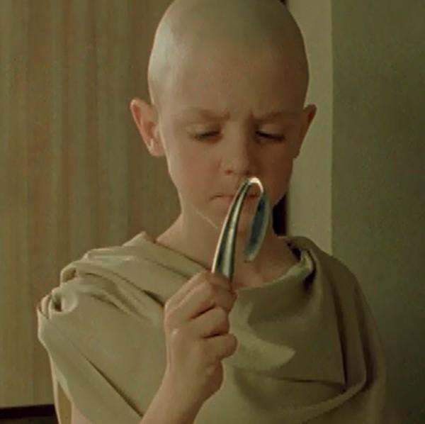 The Oracle's Place In this scene, Neo walks into the Oracle's apartment and sees a boy bending spoon with his mind.