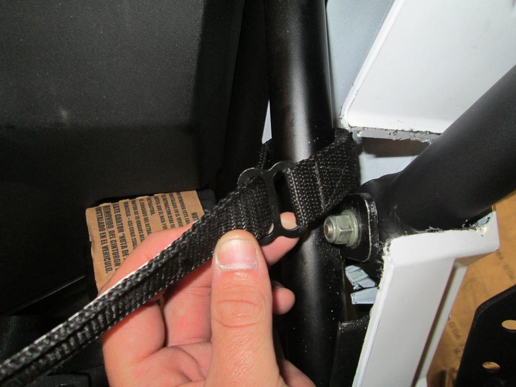 Loop the strap around the stock cage tube that the lower mount on the door attaches to like shown