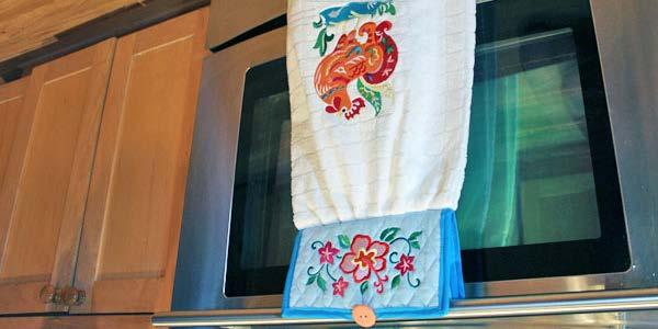 No-Slip Dish Towel An easy-to-use towel topper with a button enclosure keeps this kitchen towel at hand and ready to use in a flash.