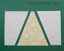 of background fabric. Repeat on the opposite side. Square the unit up to 5" by 6 ½".