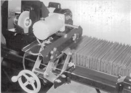 ATTACHING THE VARIABLE SPEED SPIN DRIVE UNIT TO THE REEL When spin grinding, the reel should turn in the same direction as the grinding wheel. See FIG. 27.