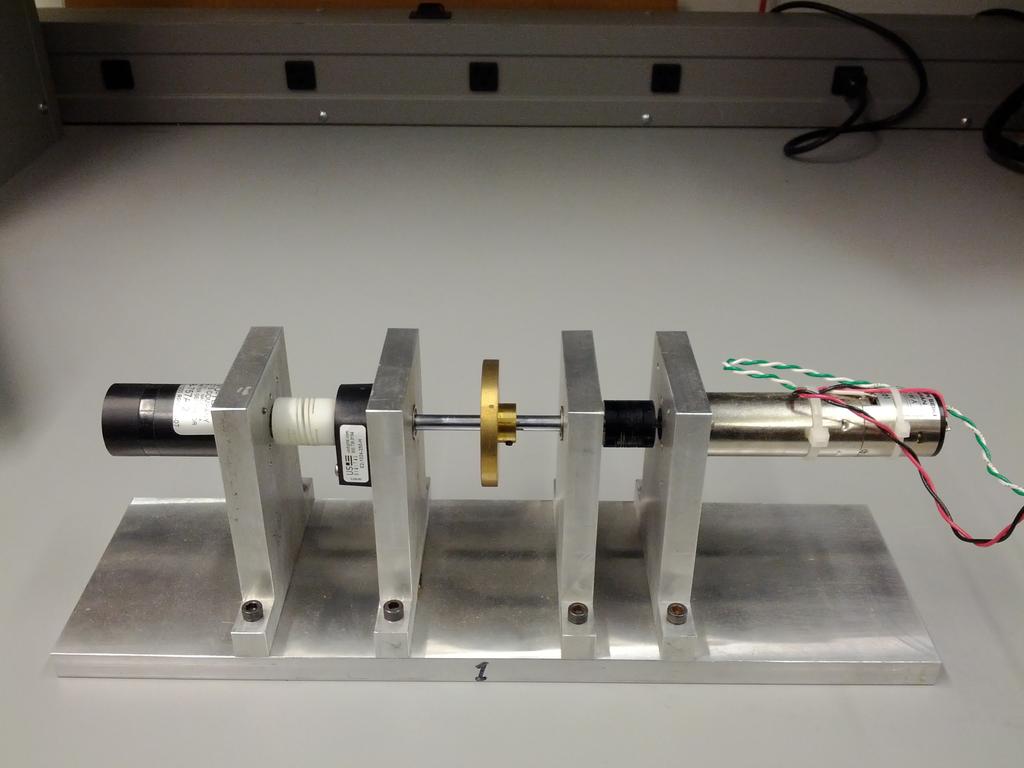 3 Laboratory Setup Fly-wheel Tachometer Encoder Motor A A B A AAU? B BN? Figure 1: Motor test stand.