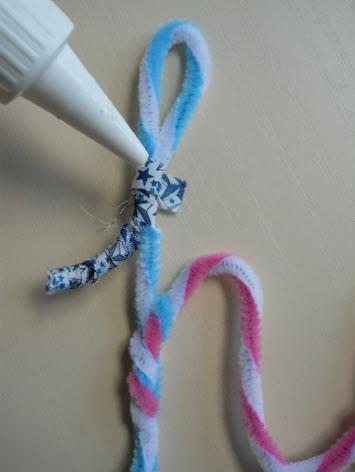 4. Wrap it up! Grab your fabric strips and your pipe cleaner word and starting at one end begin to wrap your strip around the pipe cleaners.