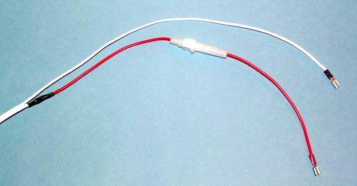 5. On one end of the power cord wire leave the separated section only 1 (2.5 cm) long. On the other end, pull or cut the two conductors apart for about 8 (20 cm).