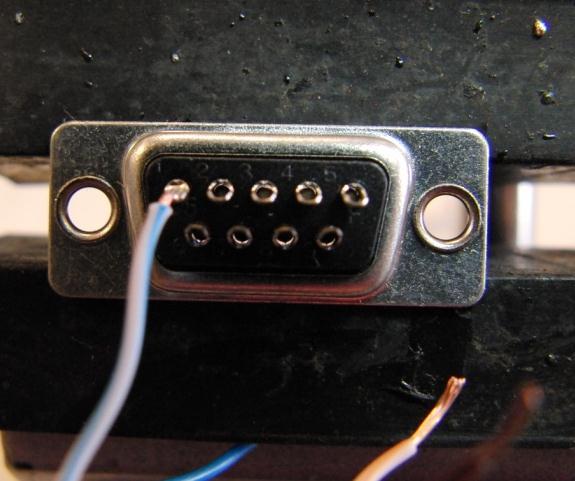 2. Place a female DB-9 connector (the connector without the pins on the front side) in a vice with the solder pins pointing towards you, five-row on top.