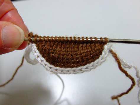 lip the needle into the stitch as shown. Gently pull crocheted chain to left releasing one stitch at a time.
