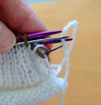BUT..... since my socks are knitted in the round, I will want to be able to identify those stitches when I am done with the bind off, so that I can finish by inserting my yarn needle into
