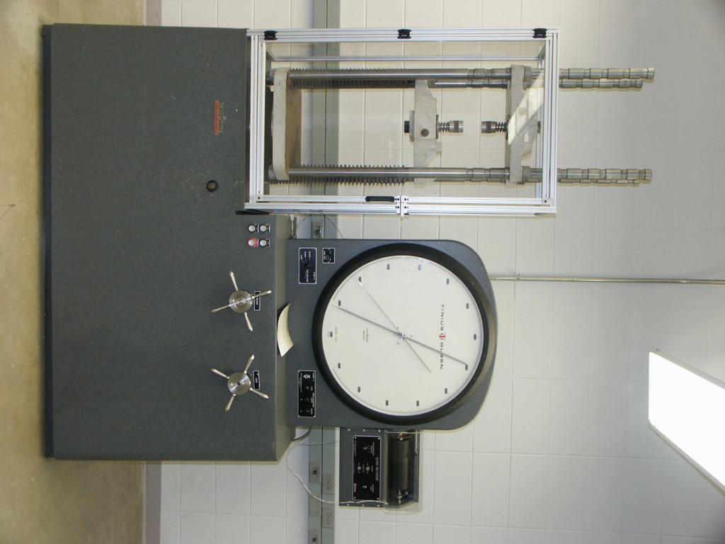 Session 1426 Figure 1: Tinius Olsen Universal Testing Machine labs as the students needed to record manually the load and elongation data.