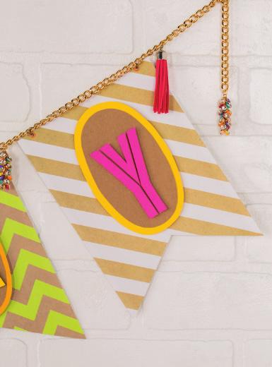 embellishments. Put it together, and what have you got? One modern DIY party scene. Pennants: Trace design of choice on patterned paper and cut. Ovals: Layer kraft paper and cardstock.