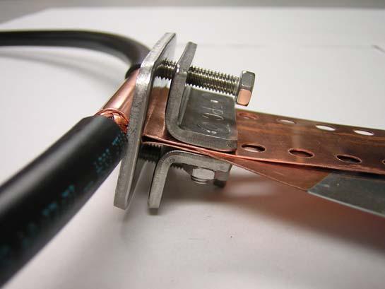 You should see some of the copper conductive joint compound squeeze out between the shield and strap as it s tightened.