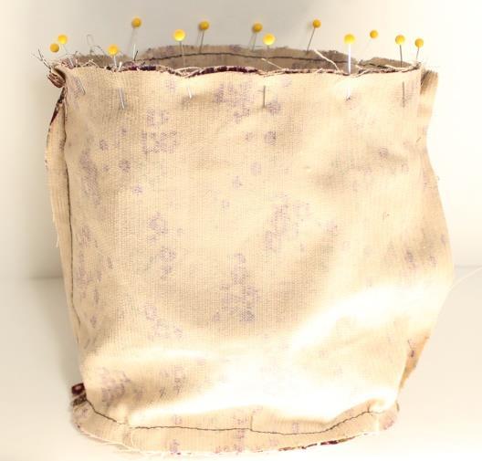 Turn the lining inside out and place the bag inside the lining with right sides