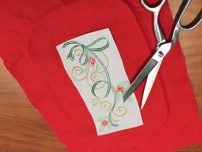the center point on the fabric. Embroider the design.