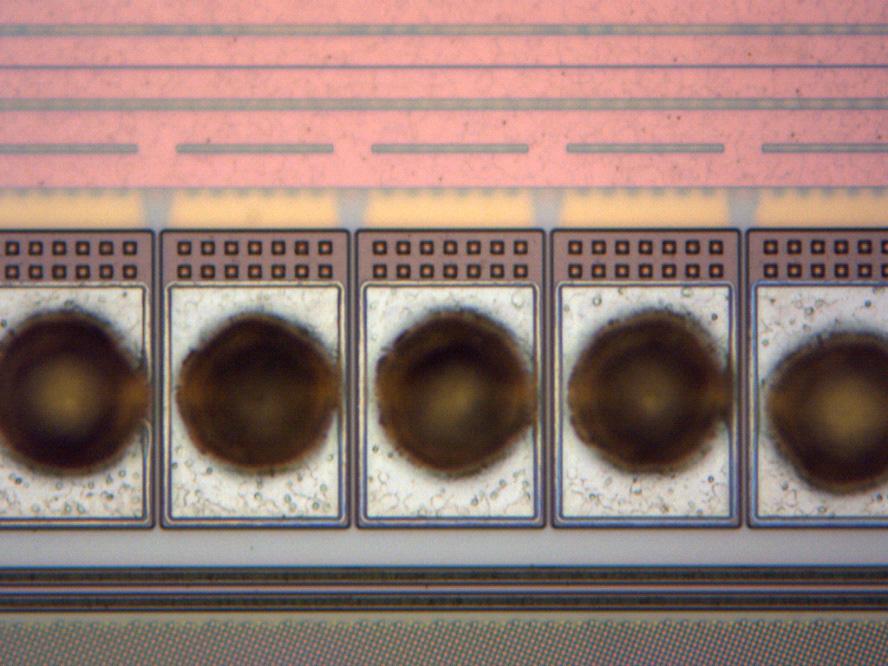 Device Identification 2-12 Figure 2.3.4 is an optical image showing the aggressive 50 µm minimum pitch bond pads. The bond pads are 75 µm long by 48 µm wide.