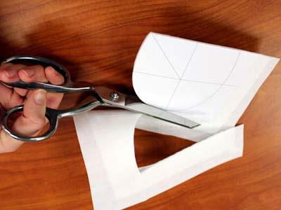 Spray the backside of the paper dieline with temporary spray adhesive and smooth onto the fabric.
