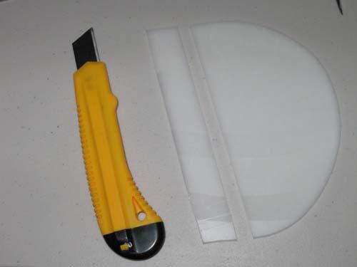 A plastic sheet of uniform thickness and a glass smooth finish.