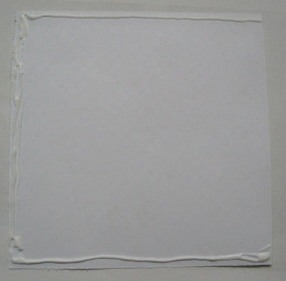Ink the edges of the paper to give an aged appearance. Glue the paper to the cardstock.