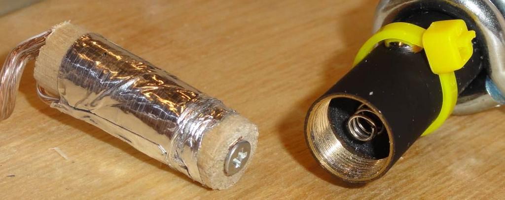 Unscrew the laser pointer and remove the batteries 2. Cut off a ~3 section of the 3/8 dowel rod and ensure it can fit inside the laser pointer snugly 3.