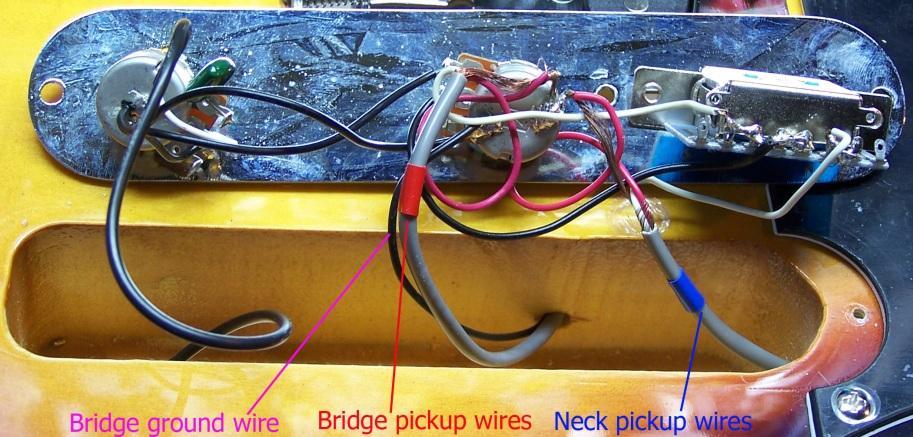 Use some tape to identify the pickup wires so they don t get switched when hooking them up to your new wiring kit. In this we used blue electricians tape for the neck and red for the bridge.