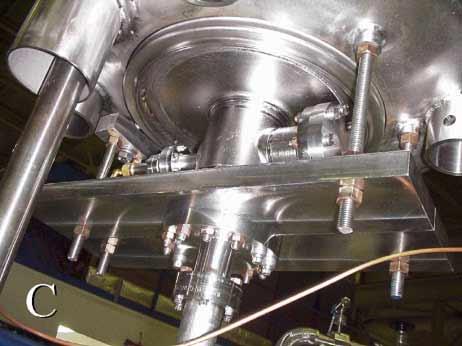 Then a mock tuner was mounted between the helium vessel and cavity, increasing the assembly stiffness to a calculated 5.43x10 4 lb/in (9.51x10 6 N/m).