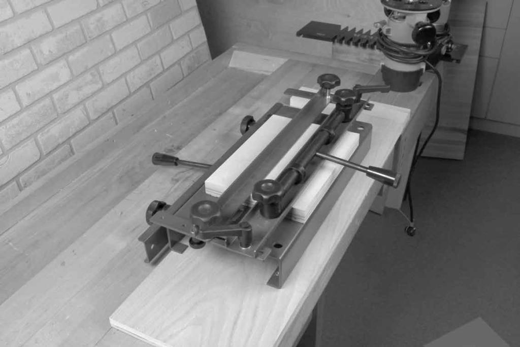 To correctly space the dovetails on the width of your stock, hold your work piece vertically in the jig as shown in (Fig. 16).