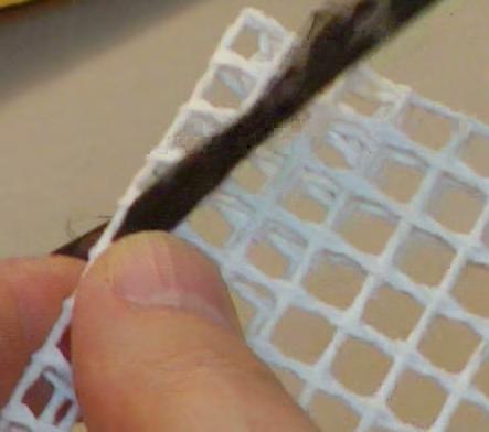 Edging the Canvas Thread tapestry needle with a narrow strip.