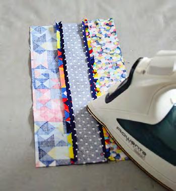 Arrange the 2 x 11 rectangles of coordinating fabrics into two sets of six each as desired.