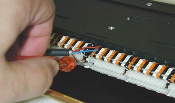imply insert the stripped wire (6 mm) after pressing down the white key with a screwdriver.