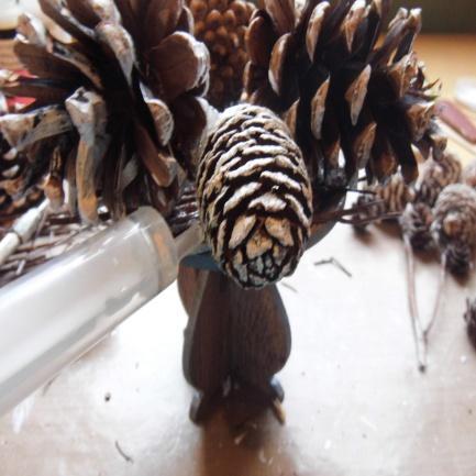 the stand. Apply some 3d glue in between the 2 pine cones to strengthen / attach them together.