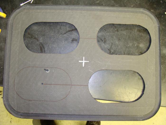 Then line up one of the adjacent holes in the template with the line you drew on the base.