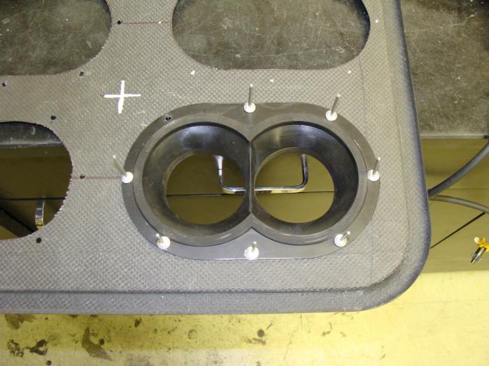 10) Place a seal in an oval hole on the base and line it up with the 8 marked rivet hole locations on the base. Using a.