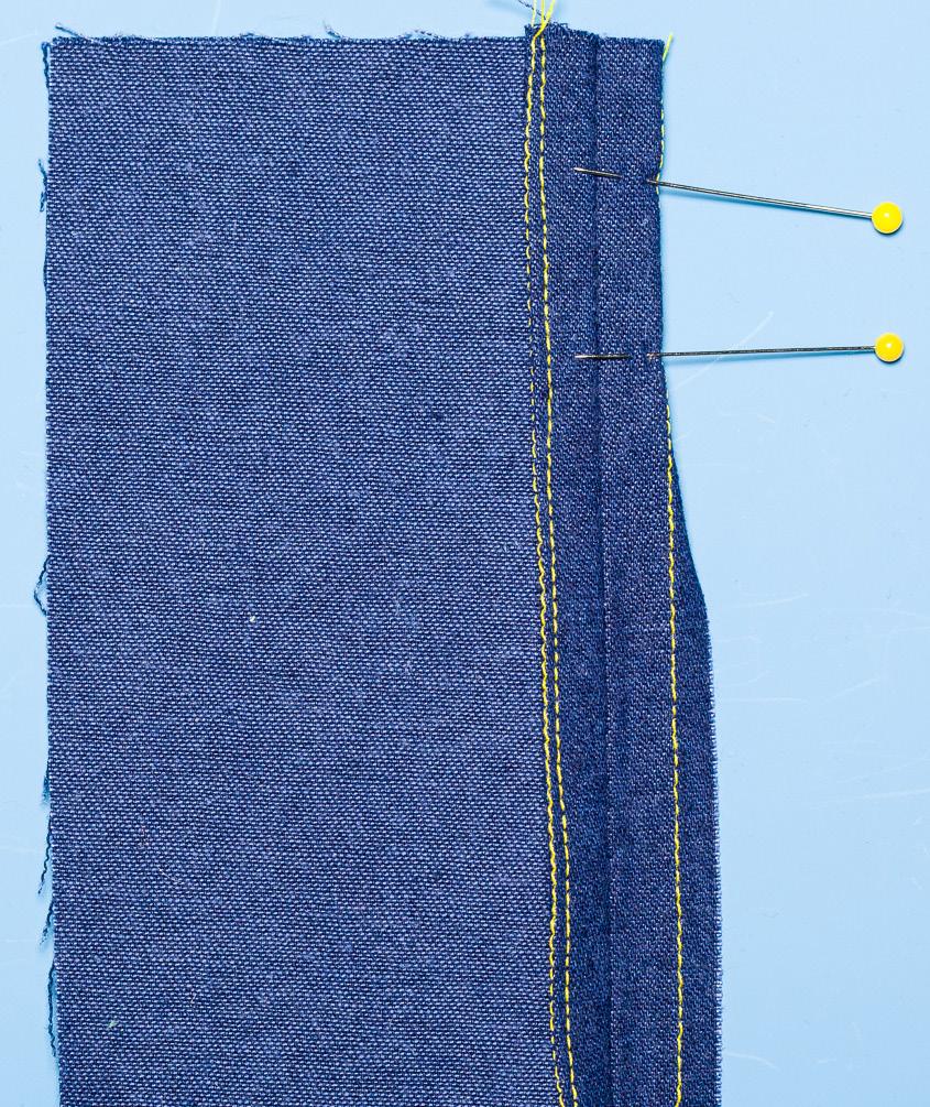 2. Beginning at the end of one seam allowance edge through single fabric thickness, secure thread on the underneath side of the seam allowance, approximately ¼ inch from the edge. 3.