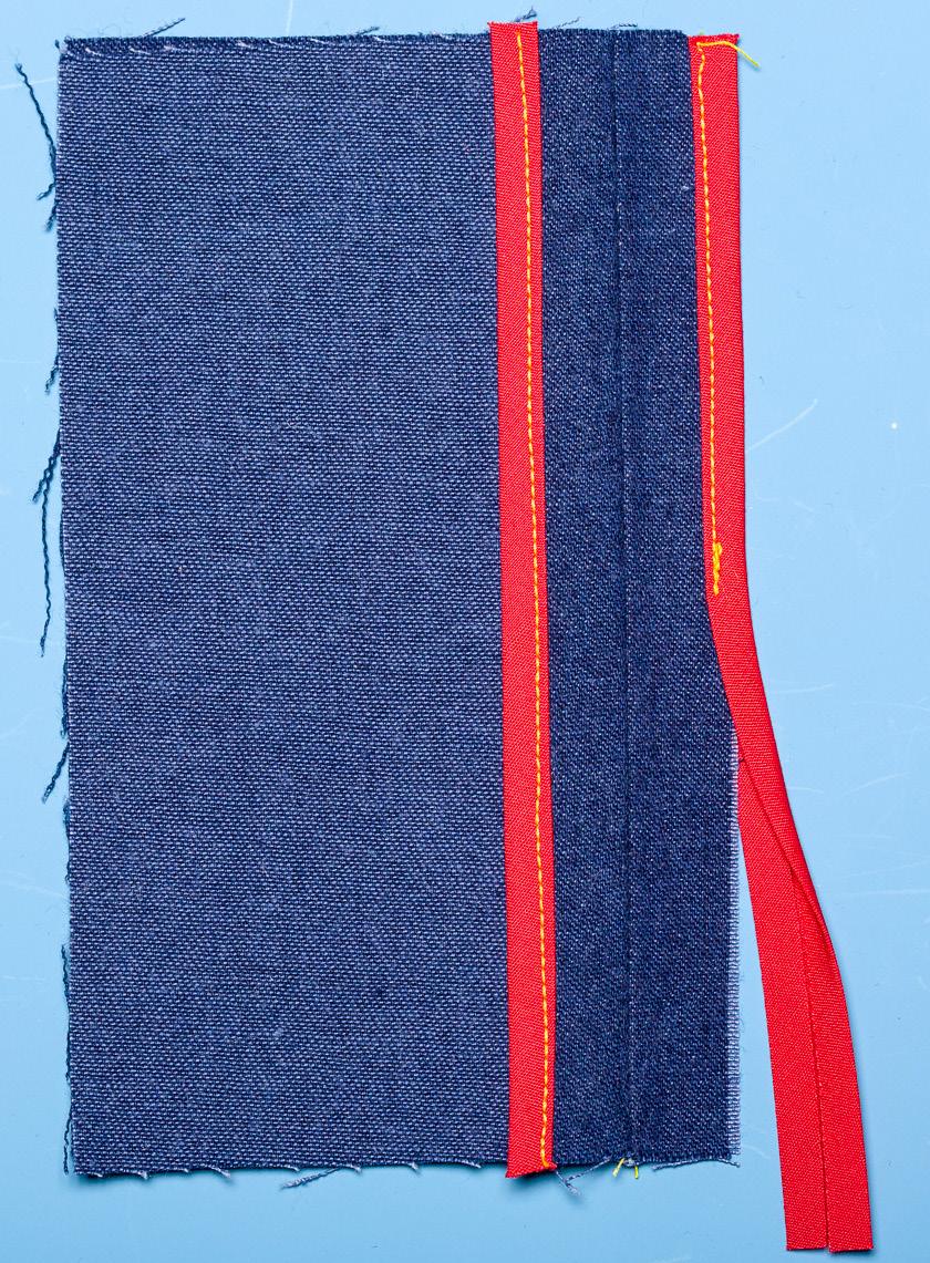 Bring the needle and thread through to the right side again. Repeat until the edge is wrapped in thread. Stitches should be secure to the fabric edge but not tight.