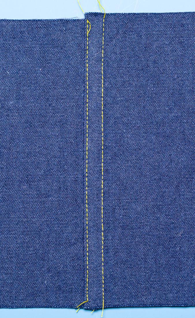 Turn the top seam allowance edge under ¼ inch. Press. 4. Stitch folded edge to under fabric, enclosing the raw edges. Flat-fell seam.