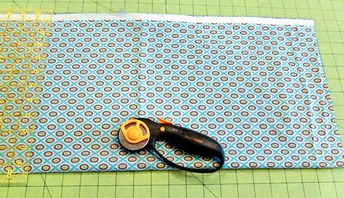 Using the rotary cutter, trim away this edge. 8. Place the ruler 21" from the trimmed end of the fabric, using your cutting mat's gridlines as your guide.