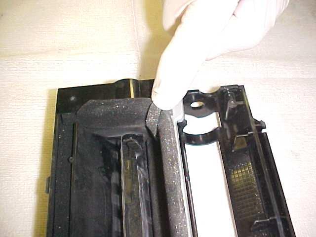 With the doctor blade replaced, add a strip of 0.25 inch rail sealing foam to seal both corners (Fig. 21).