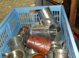 Plastic box of various metal tankards and
