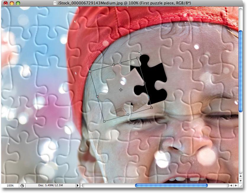 I m going to rename this layer First puzzle piece : The puzzle piece now appears on its own layer above the Puzzle layer.