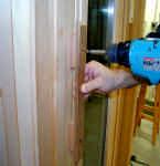 The easiest way is to nail the extension to the side of the framed opening (an alternative method is to attach the extensions to the door frame itself).