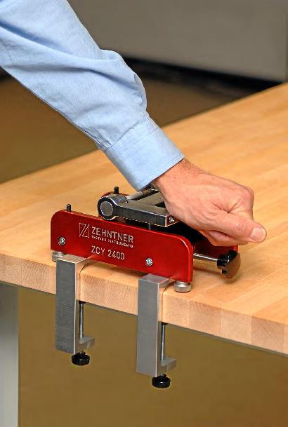 For left-handed use hold the ZCY 2400 steady with your left hand on the left side and hold the bending handle (A) with your right hand.