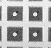 Undoped LPCVD polysilicon is grown on the wafer to fill the through-wafer vias, and the wafer is etched back to the oxide layer [Fig. 4(d)].