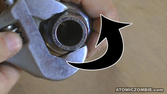 system. The top nut is removed by turning it in a counter clockwise rotation using a large adjustable wrench.