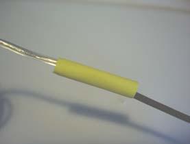 shrink tube onto9: Slide the shrink tube over the twisted wires so that no bare