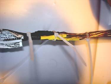 Before securing the splice with cable ties, you can tape the spliced wires together using the electrical tape (not the temflex).