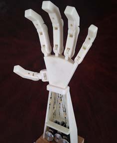 Three servos are used so that when extra EMG circuits are added in the future the hand will be capable of more tasks.